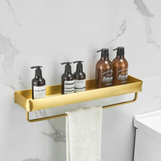 Étagère murale de salle de bain en aluminium doré fixé sur un mur