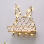 Etagère murale suspendue forme tête de lapin dorée