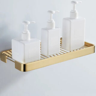 Étagère murale douche finition laiton ici avec du savon.